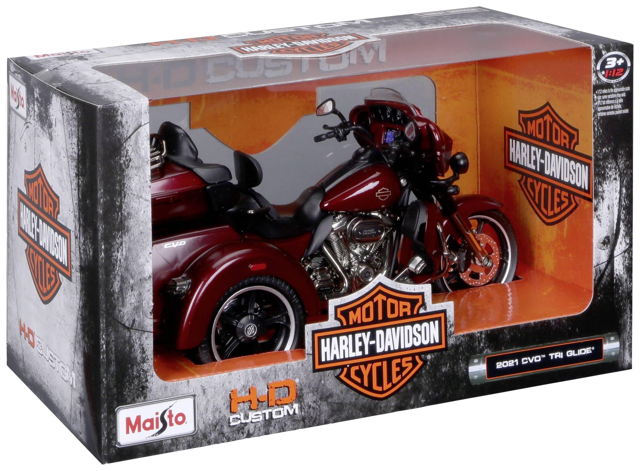 Spielzeugmodell eines Harley-Davidson "Tri Glide" Motorrads aus 2021 in Originalverpackung, rot mit Details und Logos.