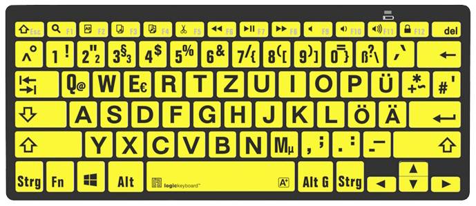 Gelbe Tastatur mit großen schwarzen Buchstaben und Symbolen. Sondertasten für Mediensteuerung und Funktionen. Benutzerfreundlich für Sehbehinderte.