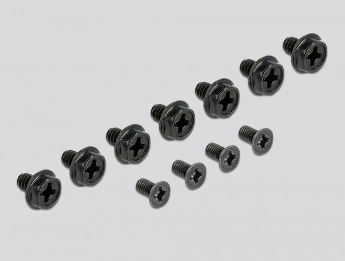 Unterschiedlich große schwarze Schrauben mit Kreuzschlitzkopf sind in zwei Reihen angeordnet, auf grauem Hintergrund.