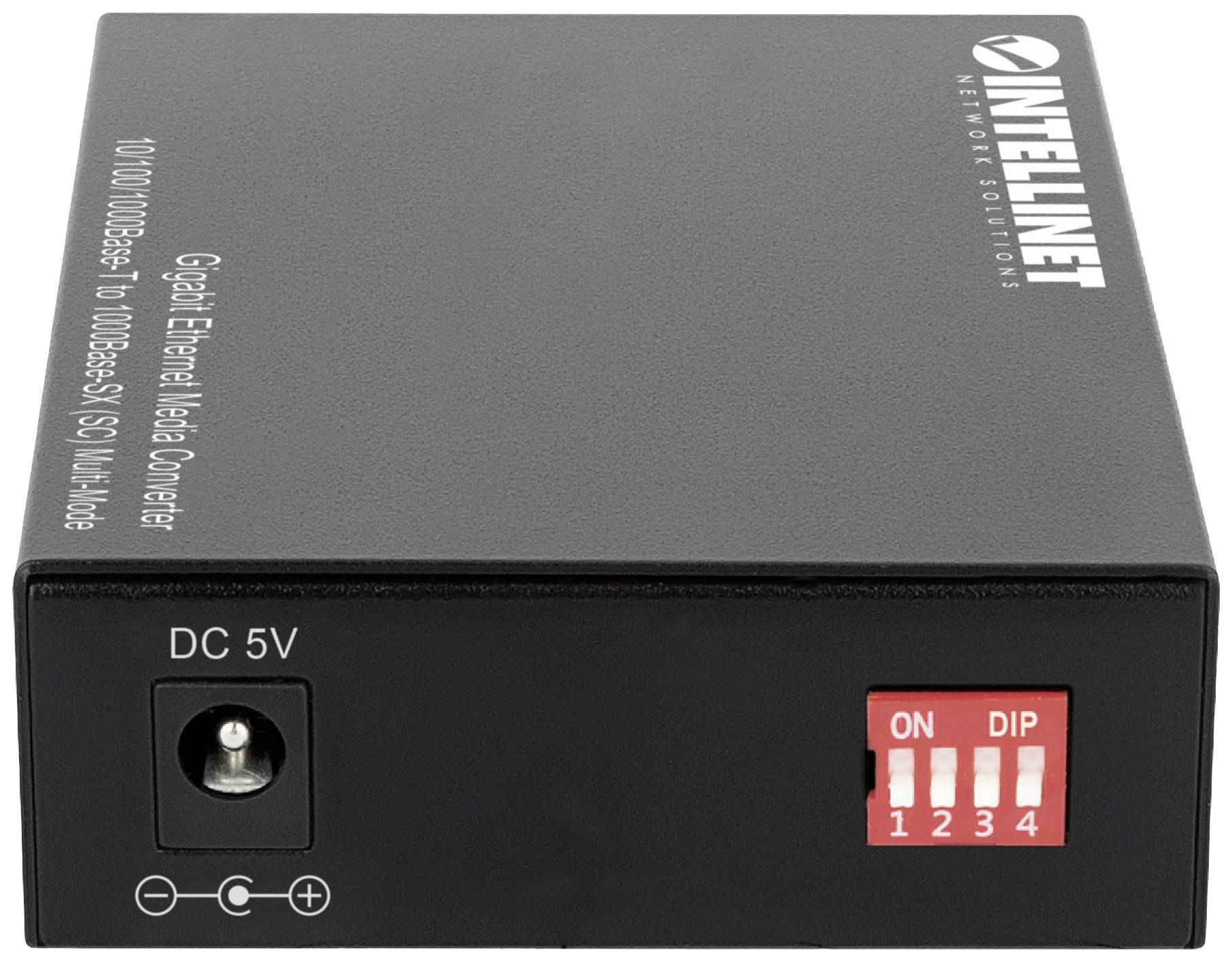 Ein schwarzer Ethernet-Medienkonverter mit DC 5V-Anschluss und vier DIP-Schaltern auf der Vorderseite.