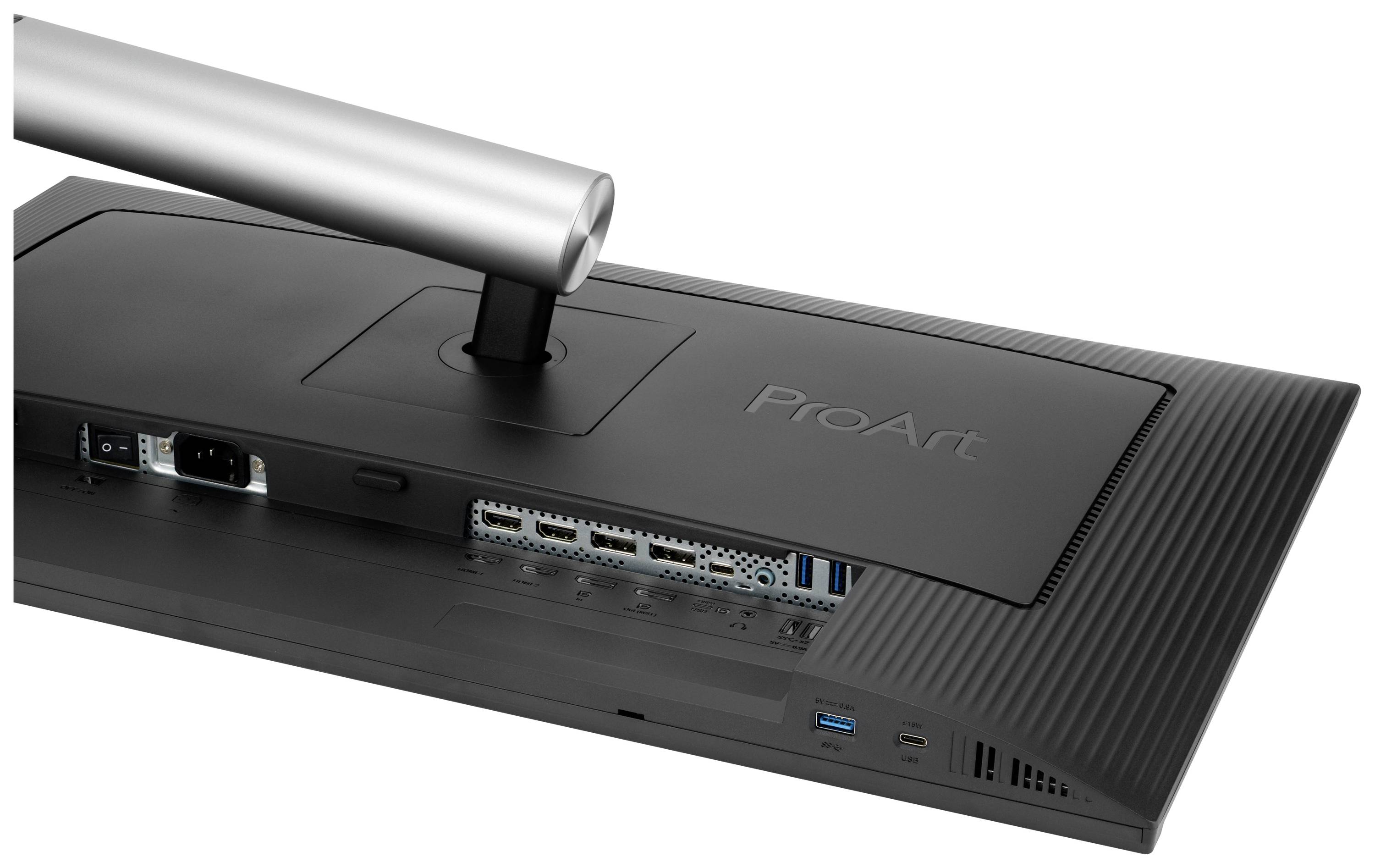 Rückseite eines ProArt-Monitors mit sichtbaren Anschlüssen: Stromanschluss, USB- und HDMI-Ports. Metalldetail des Standfußes oben links.