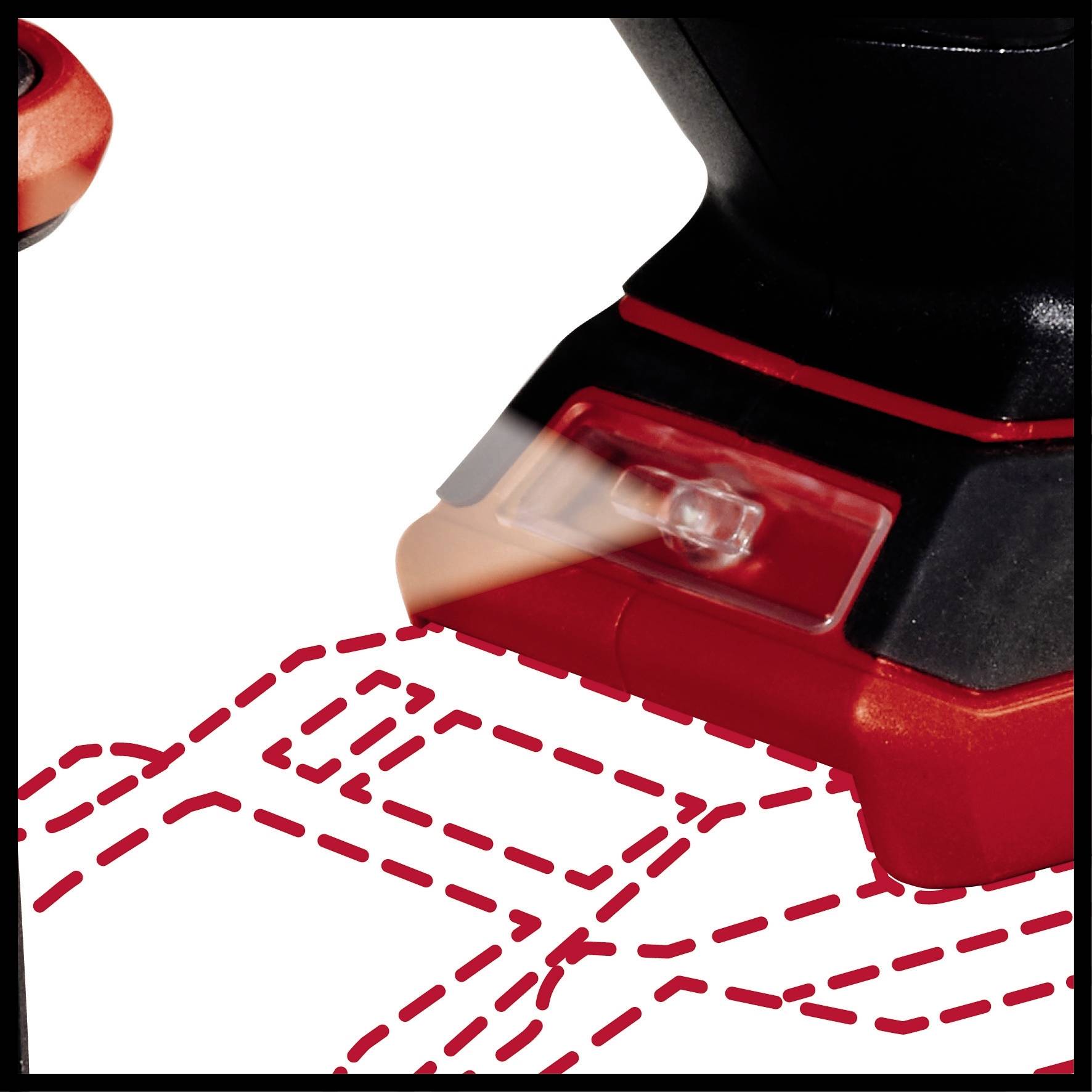 Ein rot-schwarzes Gerät zieht rote gestrichelte Linien auf einem weißen Hintergrund. Es scheint ein Werkzeug zur Markierung zu sein.