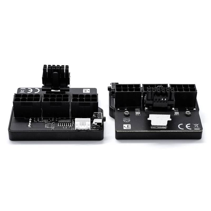 Zwei schwarze elektronische Adapter mit mehreren Anschlüssen und Platinen. Sie sind gleicher Größe und haben CE-Kennzeichnungen.