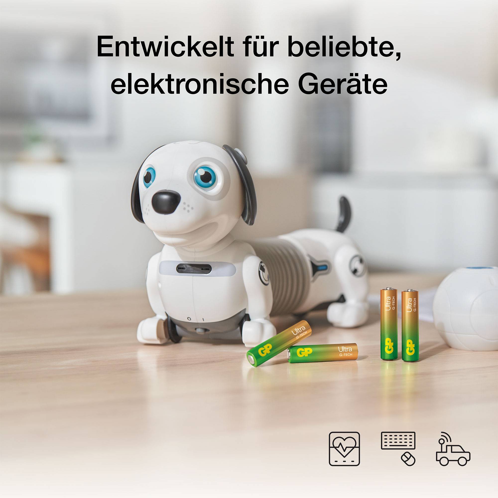 Ein Spielzeugroboter-Hund sitzt auf einem Tisch, umgeben von vier grünen Batterien. Text darüber: 'Entwickelt für beliebte, elektronische Geräte'.