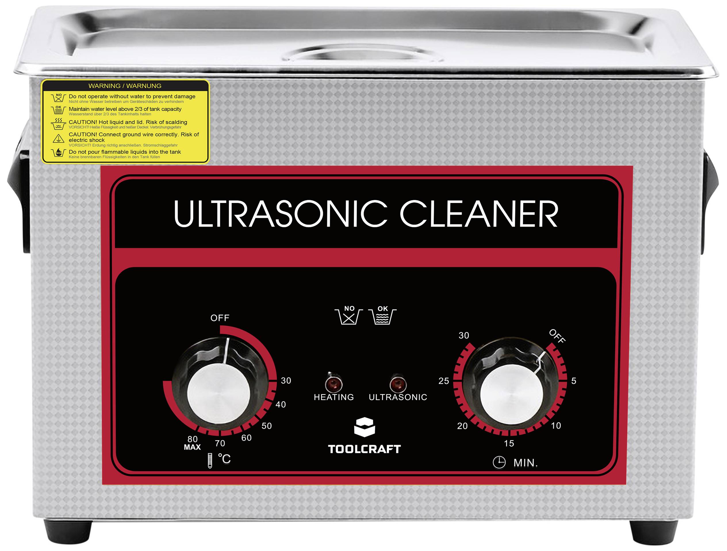Ein Ultraschallreiniger mit zwei Drehknöpfen zur Temperatur- und Zeiteinstellung. Warnhinweise und Kontrollleuchten sind sichtbar.