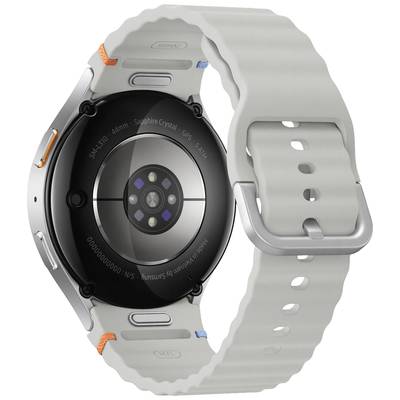 Eine Smartwatch mit rundem Gehäuse und grauem Armband, zeigt die Rückseite mit Sensoren; geeignet für Fitness-Tracking.