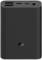 Schwarze Powerbank mit geriffelter Oberfläche, mehreren Anschlüssen oben und einem Logo in der Mitte. Ideal für mobiles Aufladen.