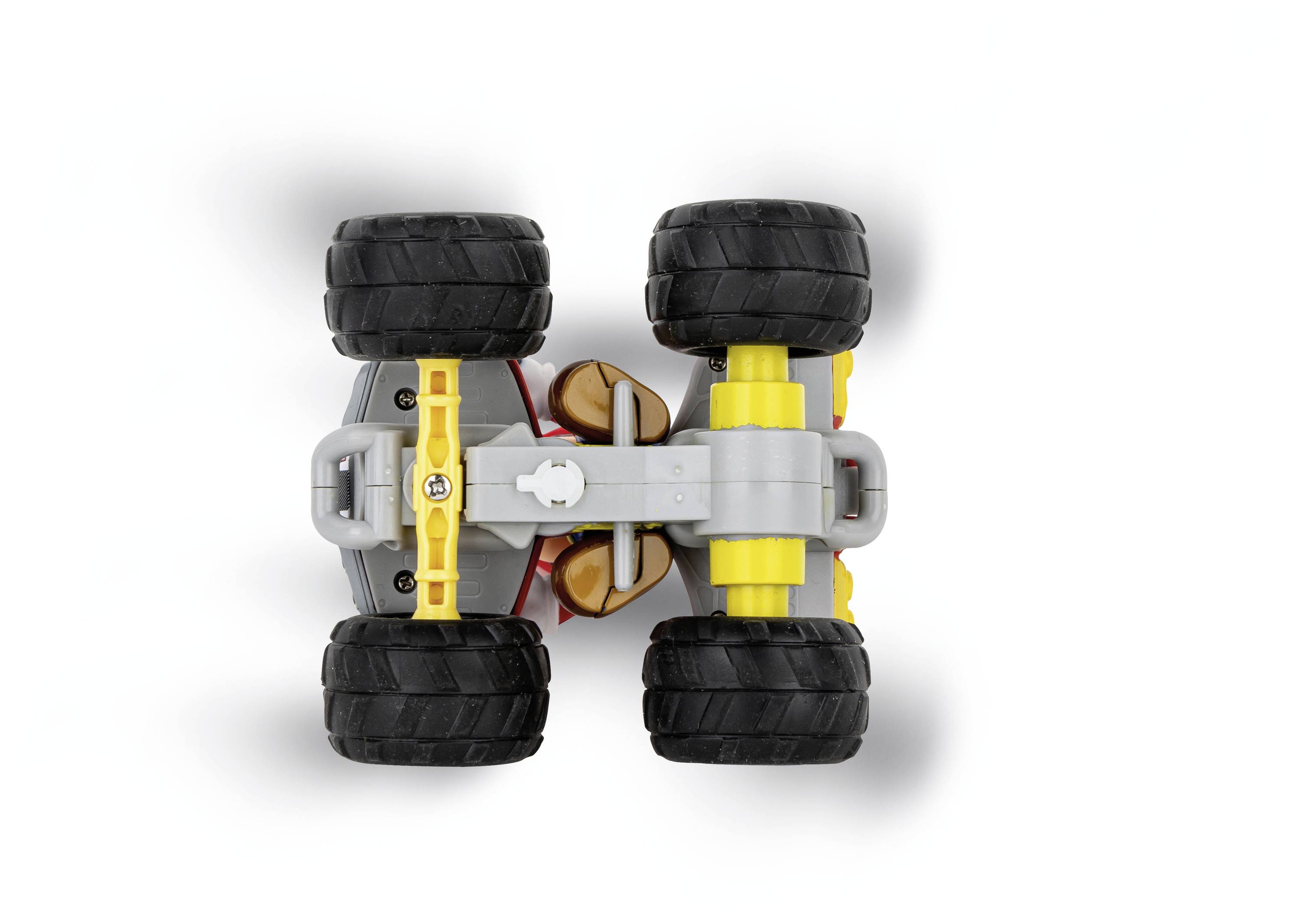 Spielzeugauto von oben mit großen schwarzen Rädern, gelben und grauen Karosserieteilen.