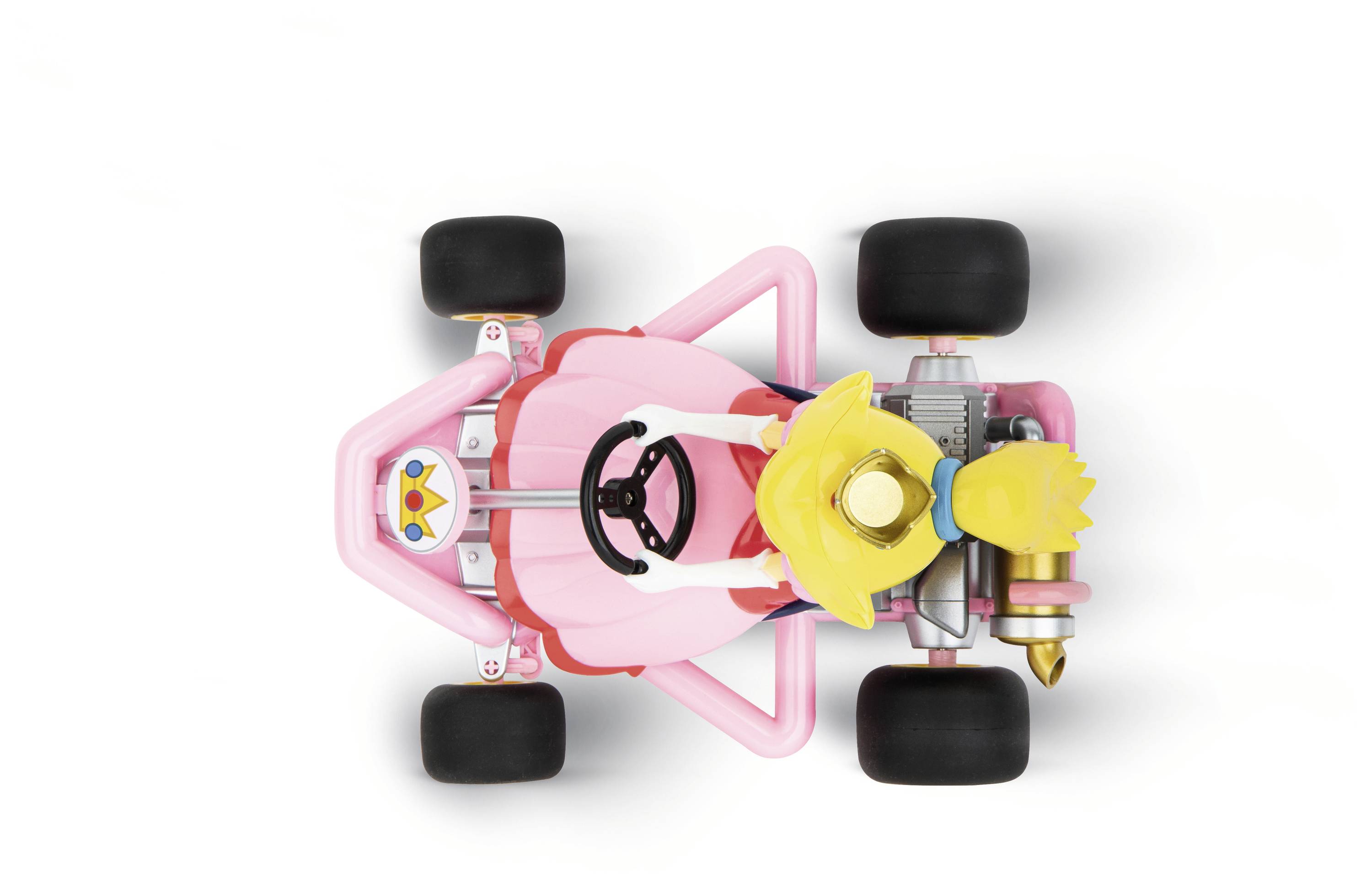 Ein rosafarbenes Spielzeugauto mit einer Figur, die ein Kleid trägt und eine Krone auf dem Kopf hat, aus der Vogelperspektive.
