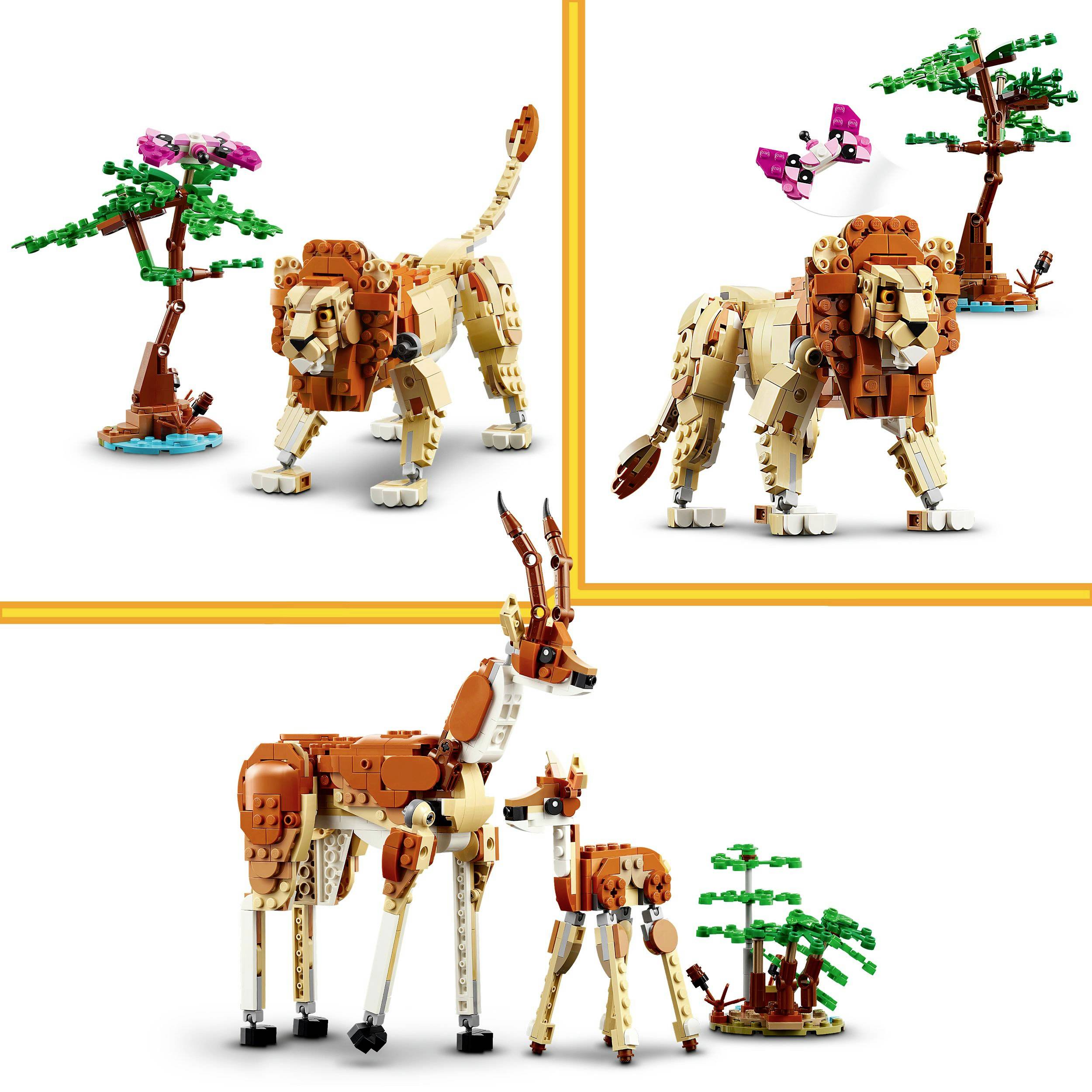 Spielzeug-Safari-Szene mit LEGO-Bausteinen: ein Löwe neben einem Baum, zwei Antilopen mit einem Baum, und ein Vogel auf einem Baum.
