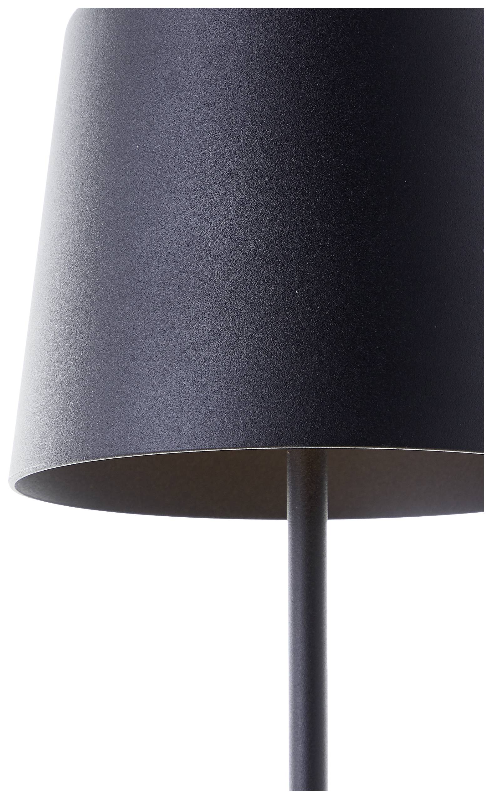 Schwarzer Lampenschirm auf schwarzem Standfuß, schlichtes, modernes Design; die Lampe steht vor einem neutralen Hintergrund.
