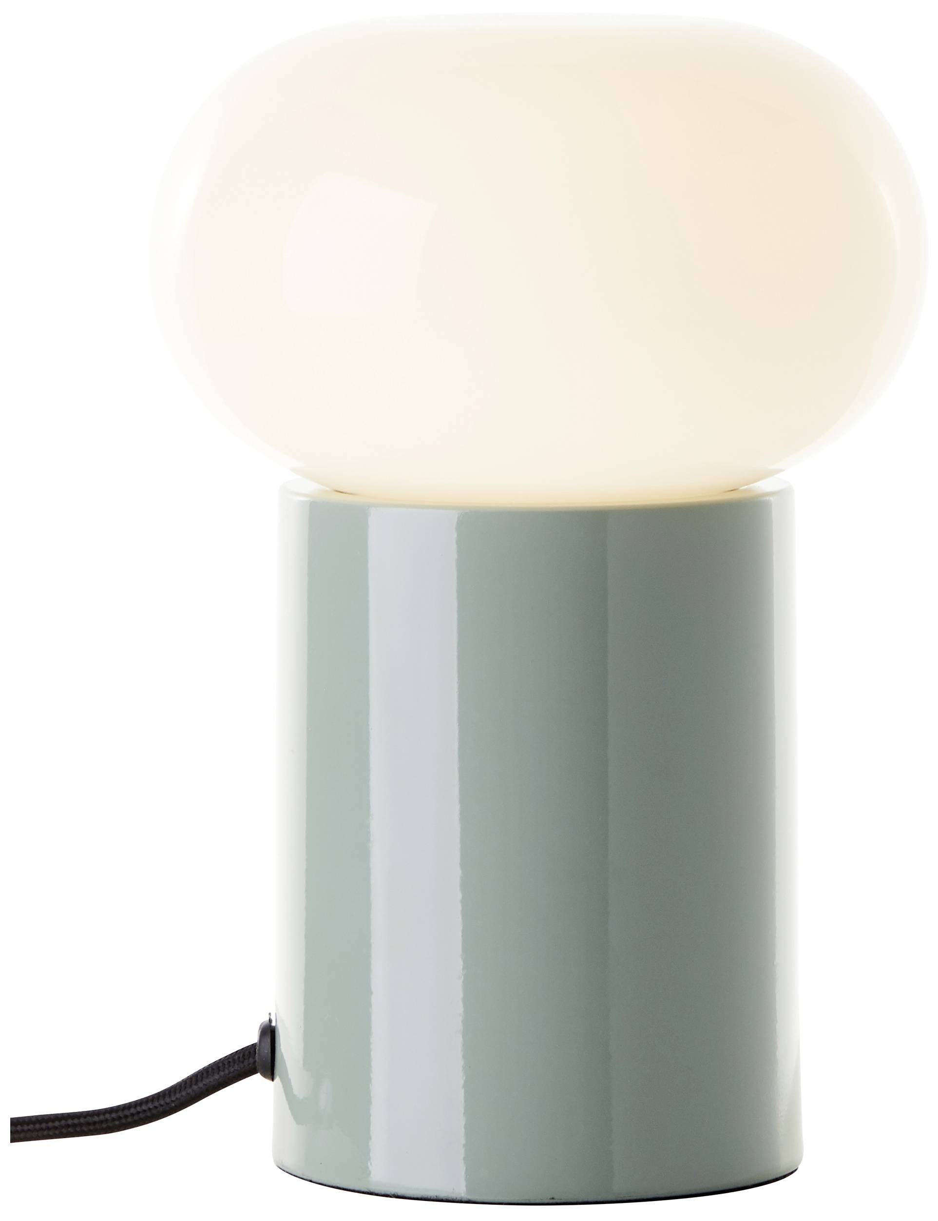 Eine Tischlampe mit rundem, weißem Leuchtkopf auf zylindrischem, graugrünem Sockel; ein schwarzes Kabel hängt seitlich.