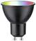 Schwarze LED-Lampe mit GU10-Fassung; Leuchtbereich zeigt Regenbogenreflexionen.