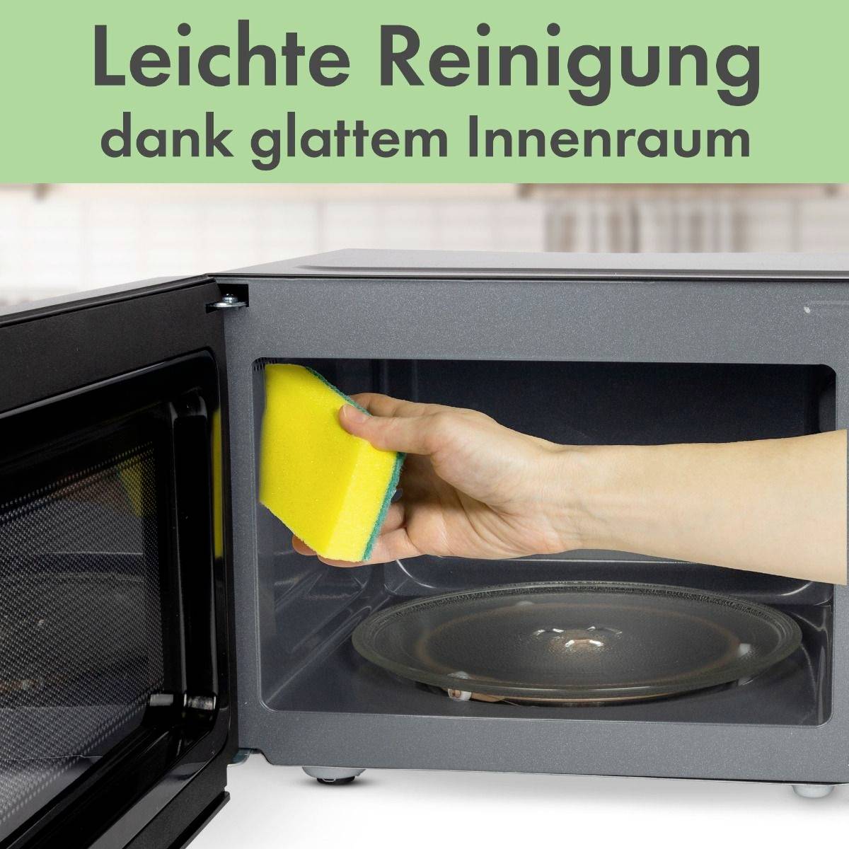 'Mikrowelle offen mit glattem Innenraum; Hand wischt mit gelbem Schwamm, begleitet von Text: Leichte Reinigung dank glattem Innenraum.'