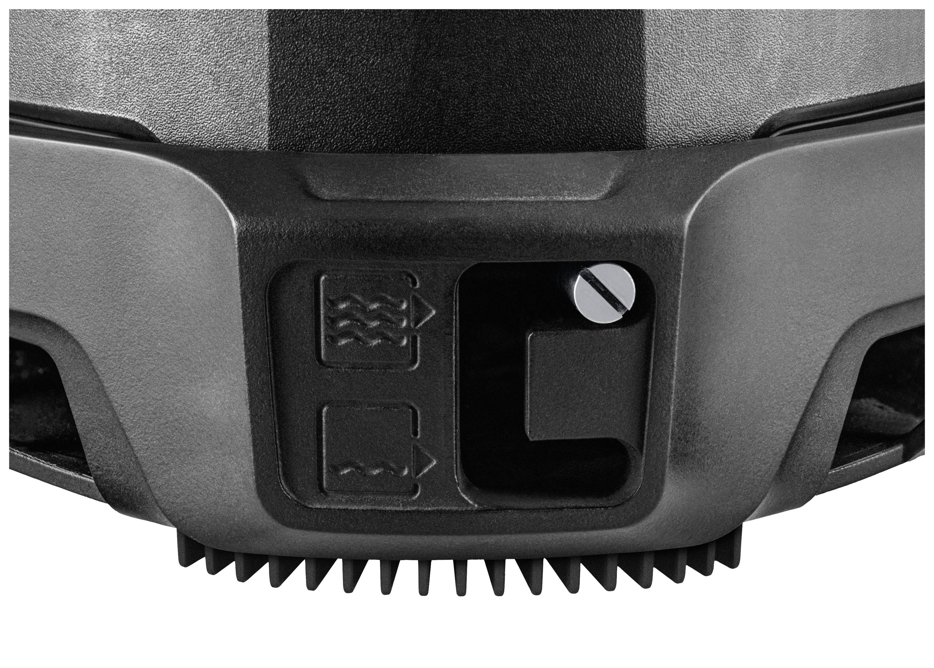 Nahaufnahme eines elektrischen Geräts mit zwei Symbolen auf der Oberfläche: ein geriffeltes Zahnrad unten, praktische Anwendung unbekannt.