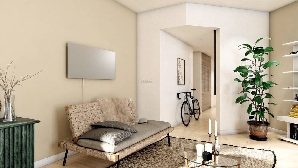 Ein modernes Wohnzimmer mit einem Sofa, einem Fernseher an der Wand, einer Pflanze, einem runden Tisch und einem Fahrrad im Flur.