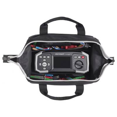 Eine schwarze Werkzeugtasche mit offenem Reißverschluss zeigt einen digitalen Multimeter der Marke 'Voltcraft ET-1000', umgeben von verschiedenfarbigen Kabeln.