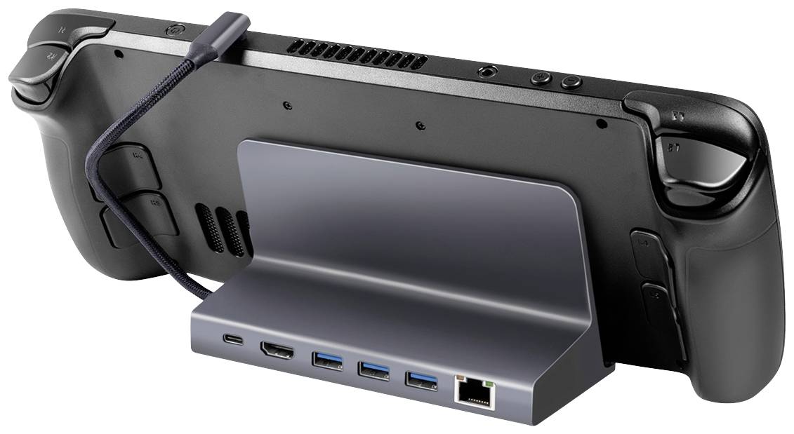Spielekonsole in Dockingstation, Rückseite sichtbar, zeigt USB-Anschlüsse und HDMI-Port. Kabel verbunden, bereit zur Nutzung.