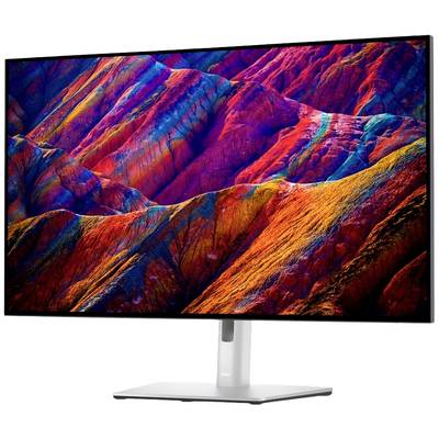 Ein Computerbildschirm zeigt ein lebhaft gefärbtes Bergpanorama. Die Farben reichen von Rot über Lila bis Blau und schaffen ein dynamisches Bild.