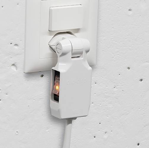 Ein weißer Lichtschalter an einer Wand, darunter ein weißes Gerät im Schalter.