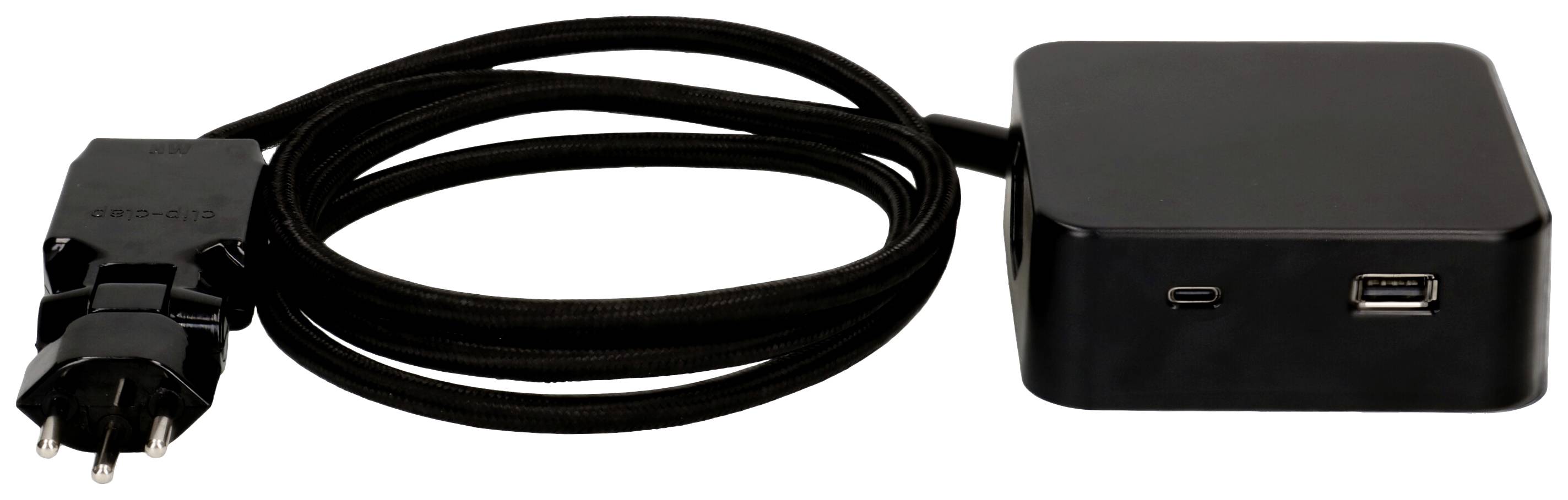 Schwarzes Ladegerät mit fest angeschlossenem Netzkabel und zwei USB-Anschlüssen zum Laden elektronischer Geräte.
