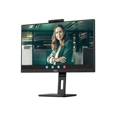 Eine Person in einem Videoanruf auf einem Computermonitor. Die Person trägt einen Blazer und lächelt leicht in einem Büro.