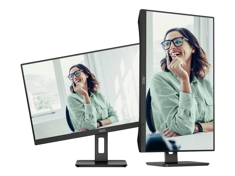 Zwei Computerbildschirme zeigen eine fröhliche Frau mit Brille in einem grünen Hemd. Ein Bildschirm ist im Hochformat, der andere im Querformat aufgestellt.