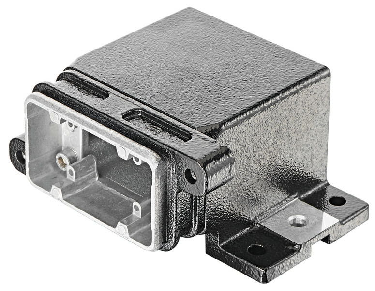 Ein schwarzes elektronisches Gerät mit Metallgehäuse und Befestigungsöffnungen, wahrscheinlich für Automobil- oder elektronische Anwendungen.