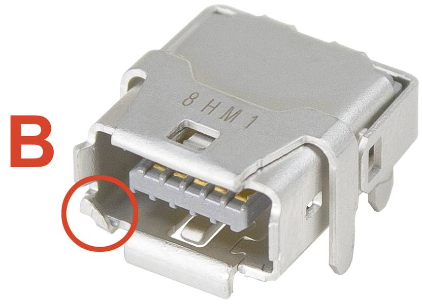 'Mikro-USB-Buchse, Typ B, mit fünf Pins sichtbar. Ein roter Kreis hebt ein Strukturdetail an der linken unteren Ecke hervor.'