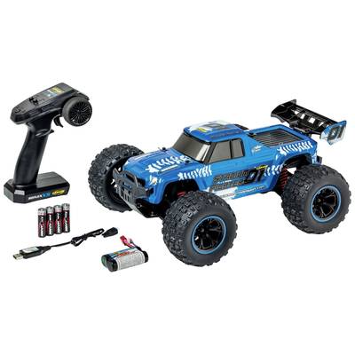 Spielzeug-RC-Truck in Blau mit Fernsteuerung, Batterien und Ladegerät. Robuster Offroad-Stil, großflächige Reifen, sportliches Design.