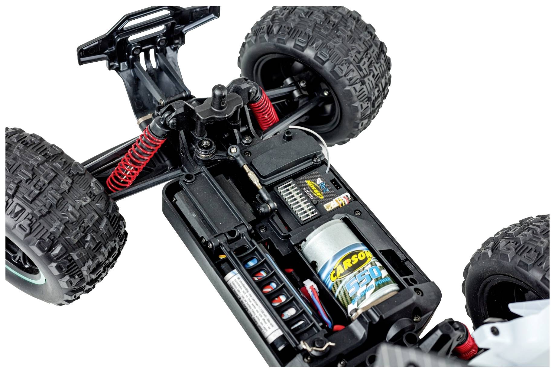 Ein ferngesteuertes Auto-Chassis mit freigelegter Batterie, Motor und Stoßdämpfern, zeigt technische Details und Aufbau.