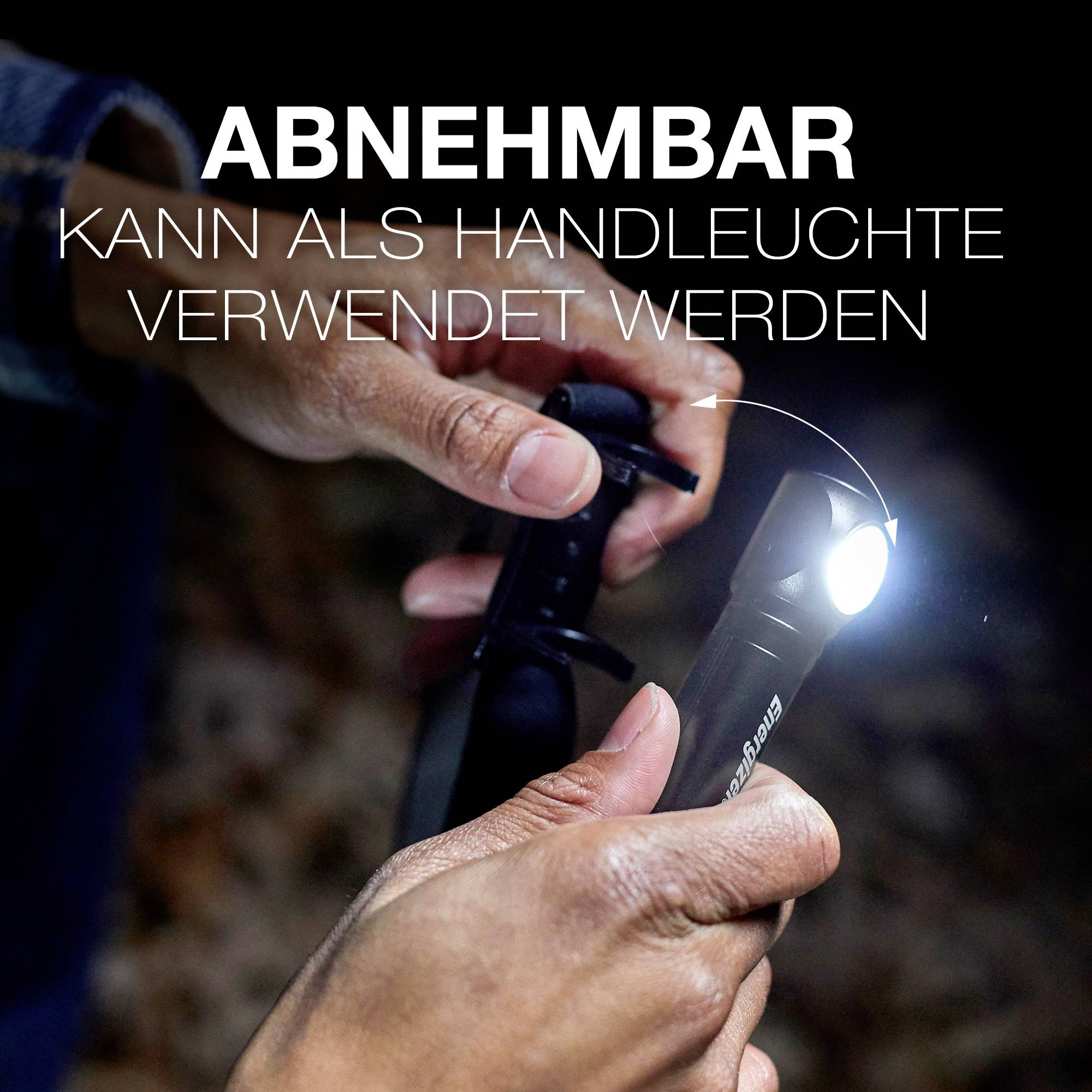 Eine Person hält eine abnehmbare Taschenlampe, die intensiv leuchtet. Text im Bild: 'ABNEHMBAR Kann als Handleuchte verwendet werden'.