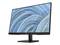 Ein schwarzer Computerbildschirm mit einem blauen und grünen abstrakten Hintergrundmuster auf dem Display, steht auf einem Tisch.