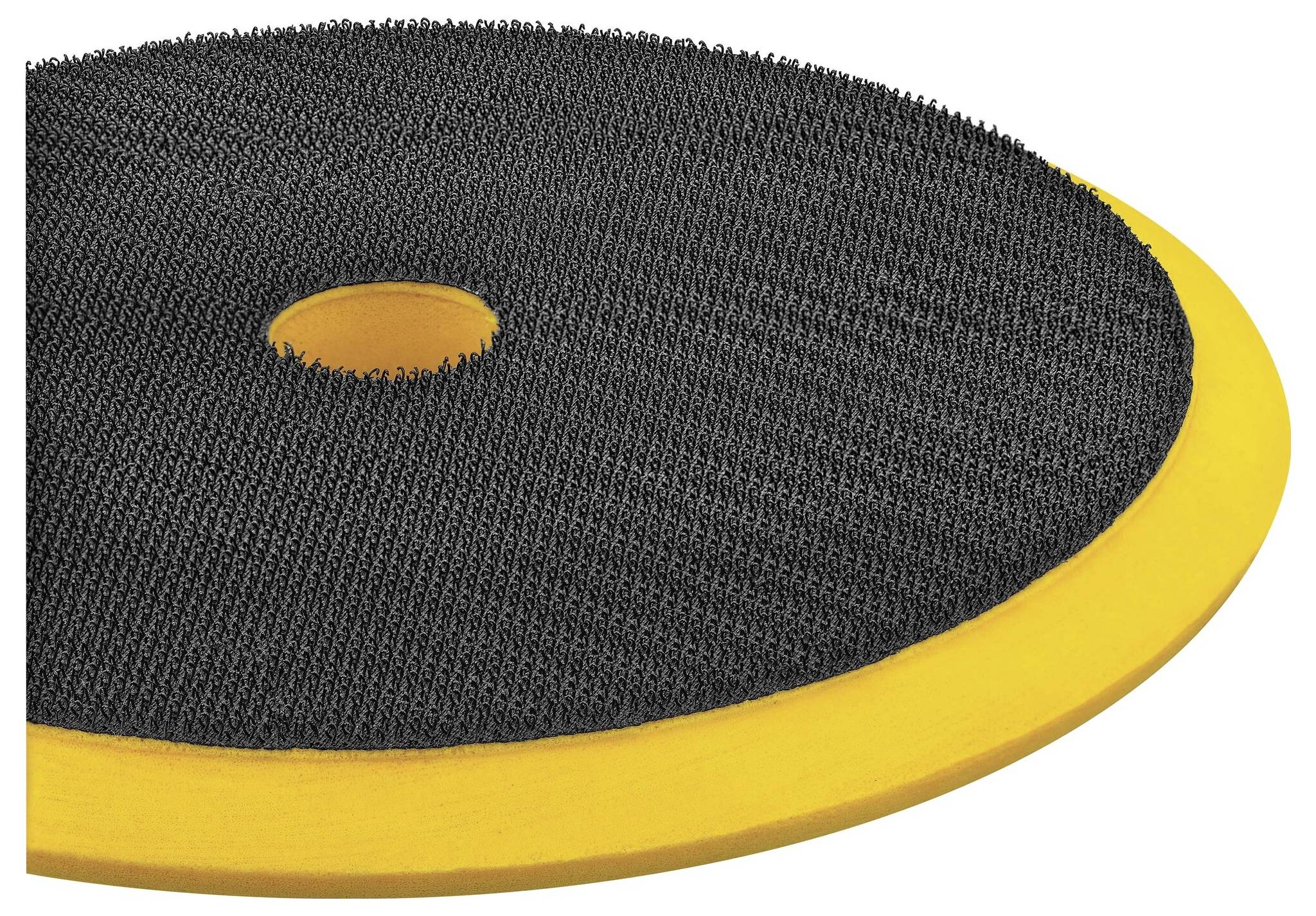 Schleifscheibe mit schwarzer Klettverschluss-Oberfläche und gelbem Rand, verwendet für das Anhaften von Schleifpapier an Maschinen.