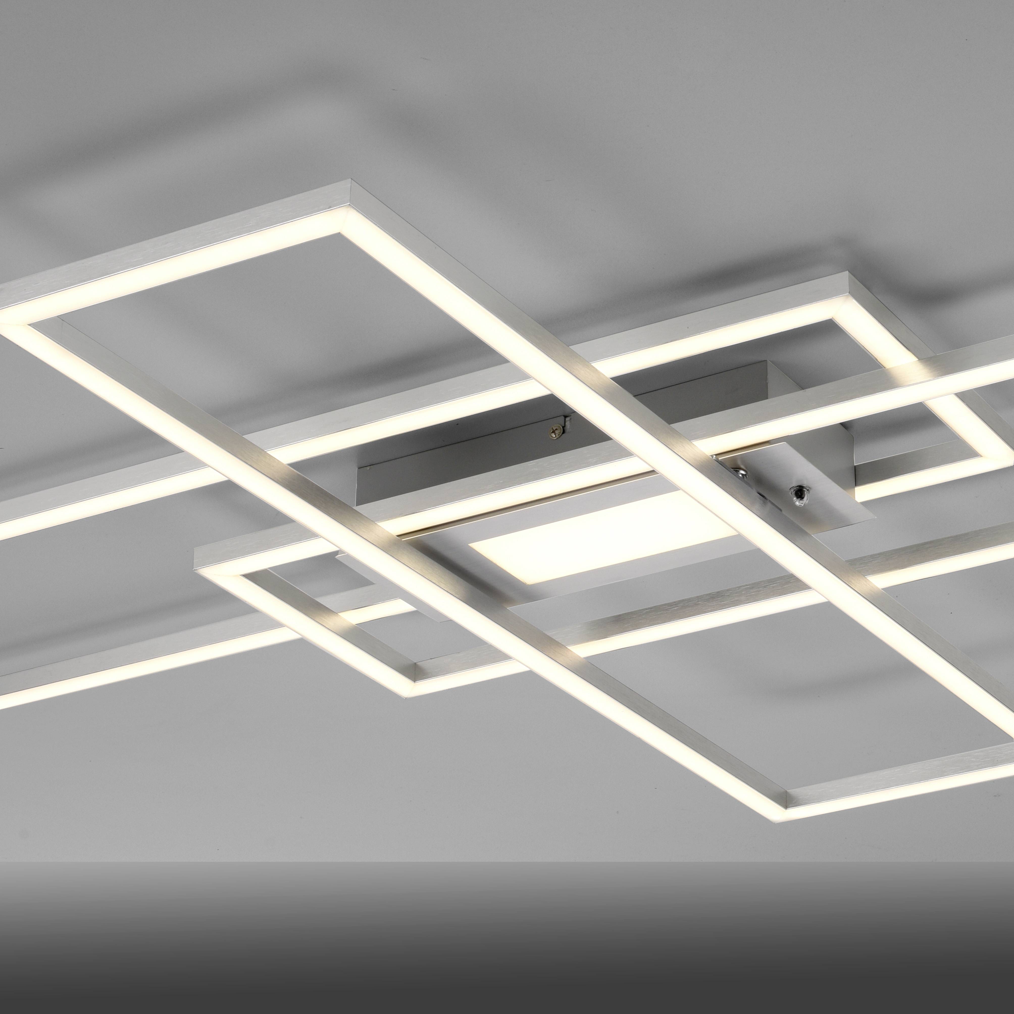 Eine weiße, geometrisch gestaltete Deckenlampe mit rechteckigen Rahmen. Sie leuchtet hell und sorgt für moderne Beleuchtung.