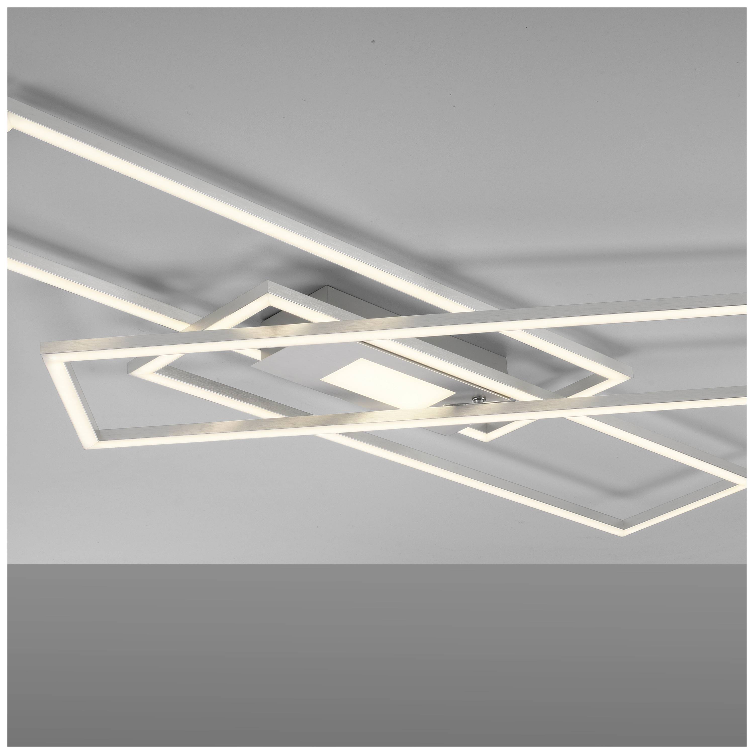 Rechteckige, moderne Deckenleuchte mit klaren Linien. Sie strahlt ein weiches, diffuses Licht aus und hat ein minimalistisches Design.