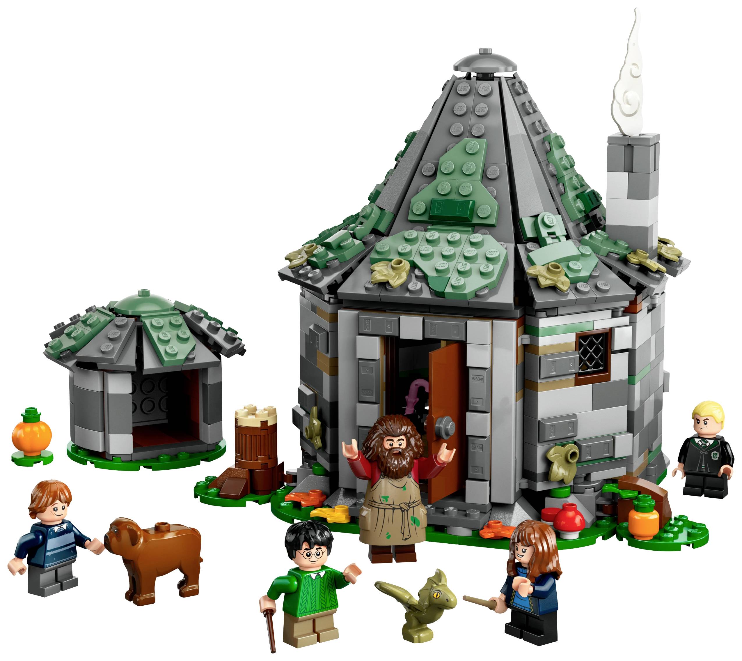 Ein kleines, rundes Häuschen aus Legosteinen mit einem spitzen Dach, umgeben von Legomännchen, darunter ein bärtiger Mann und drei Kinder.