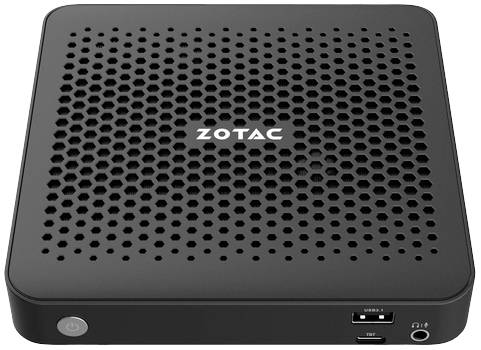 Kompakter schwarzer Mini-PC mit Wabenmuster und 'ZOTAC'-Logo auf der Oberseite. Vorderseite mit USB-Anschluss und Audiobuchse.