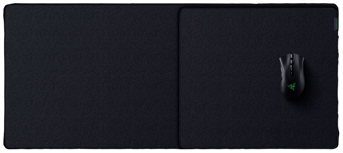 Großes, schwarzes Mousepad mit einer schwarzen Computermaus darauf. Die Maus hat ein leuchtendes Logo.