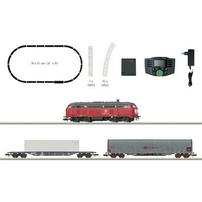 Ein Modelleisenbahn-Set: rote Lokomotive und zwei Waggons, mit Gleisplan und Steuerungskomponenten. Zubehör und Maße oben dargestellt.