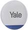 Ein rundes, weißes Alarmsystem mit der Aufschrift 'Yale' in grauer Schrift und einem blauen Abschnitt unten.