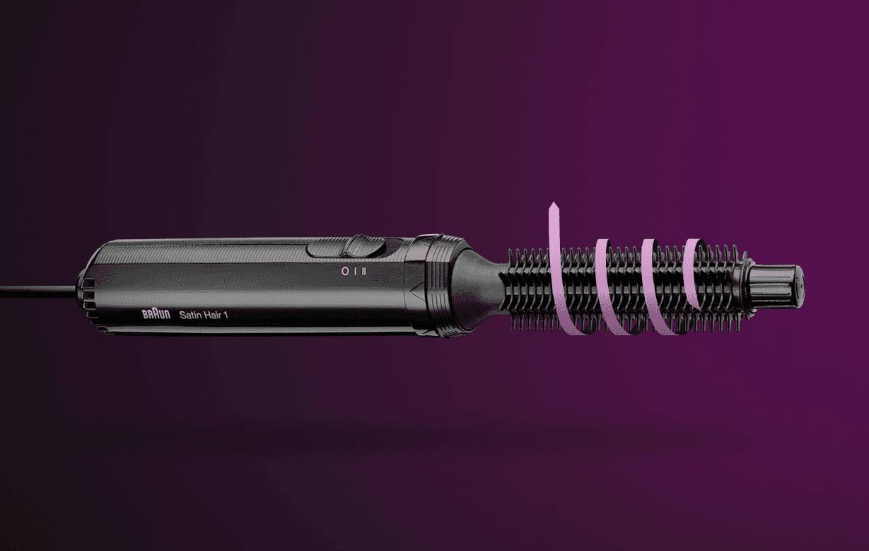 Ein schwarzer elektrischer Haarstyler mit rosa Spirale auf der Bürste, vor lila Hintergrund.