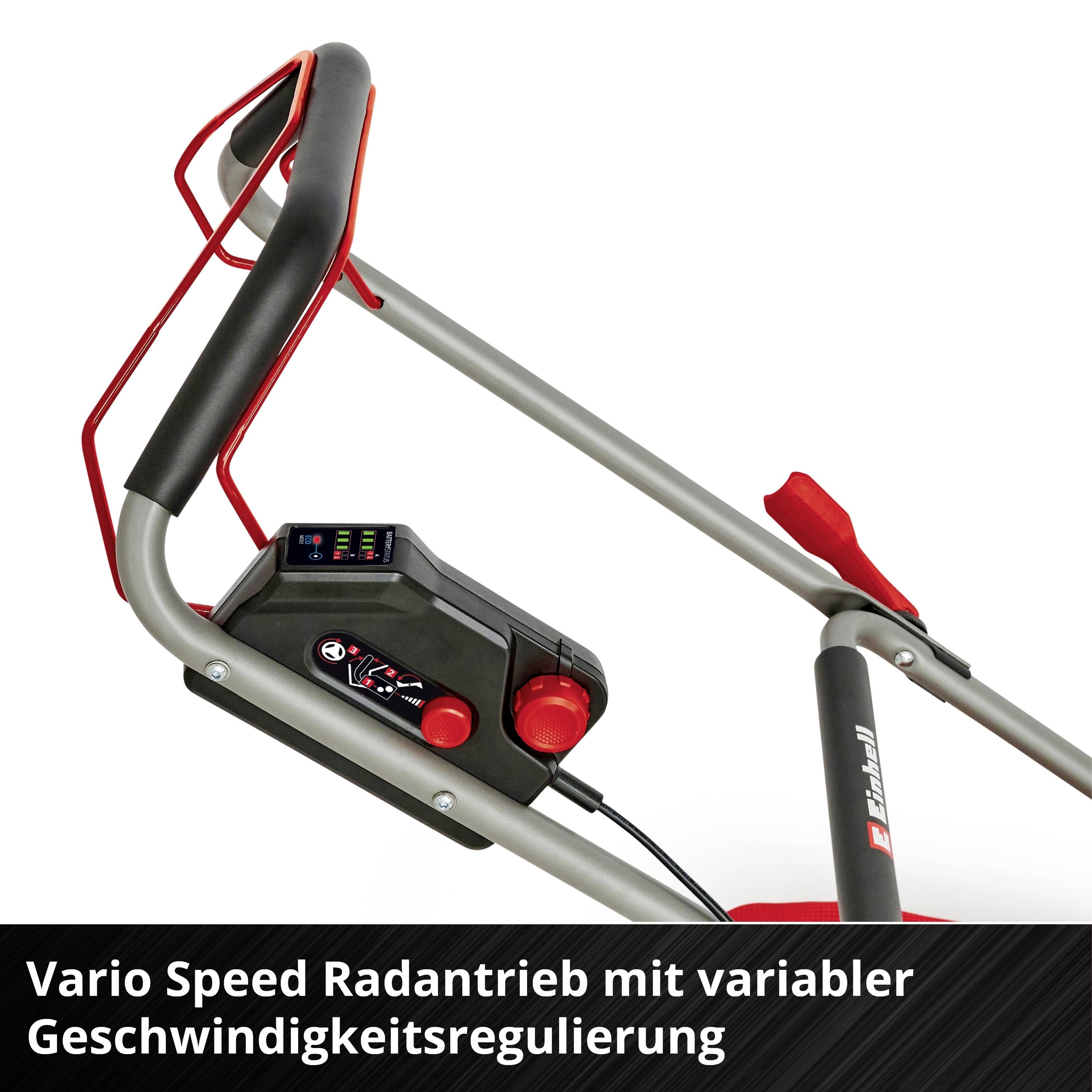 'Rasenmähergriff mit Steuerung, rotem Hebel und Geschwindigkeitsregler. Text: Vario Speed Radantrieb mit variabler Geschwindigkeitsregulierung.'