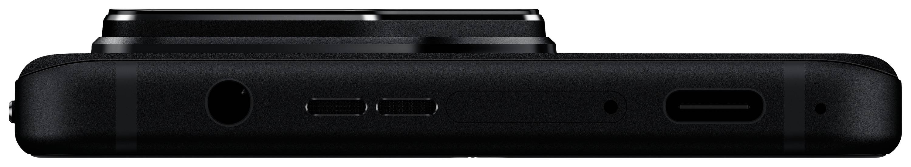 Unterseite eines Smartphones mit Kopfhöreranschluss, Lautsprecheröffnungen und USB-C-Anschluss. Gerät in schwarzer Farbe.