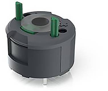 Ein kleiner, runder, grauer elektronischer Bauteil mit grünen Elementen oben, vermutlich ein Sensor oder ein Schalter.