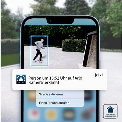 Nachricht auf Smartphone: 'Person um 15:52 Uhr auf Arlo Kamera erkannt'. Person beim Joggen vor einem modernen Haus sichtbar.