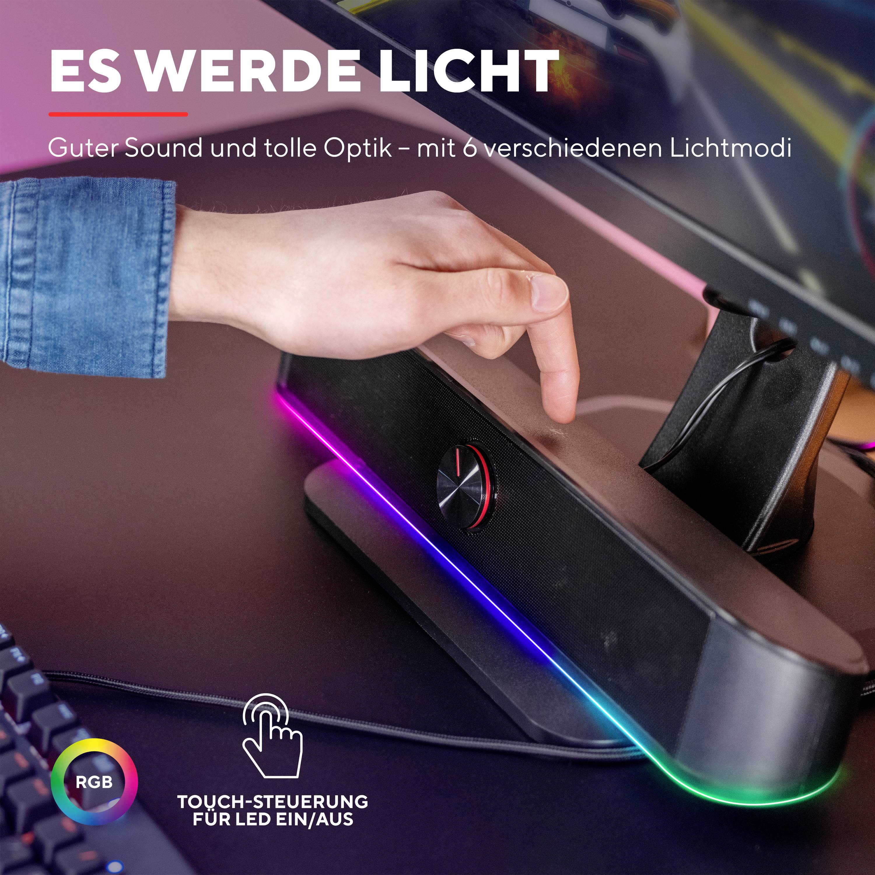 Eine Hand berührt einen Lautsprecher mit LED-Beleuchtung, darunter der Text 'Es werde Licht'. RGB-Farben und Touch-Steuerung werden hervorgehoben.