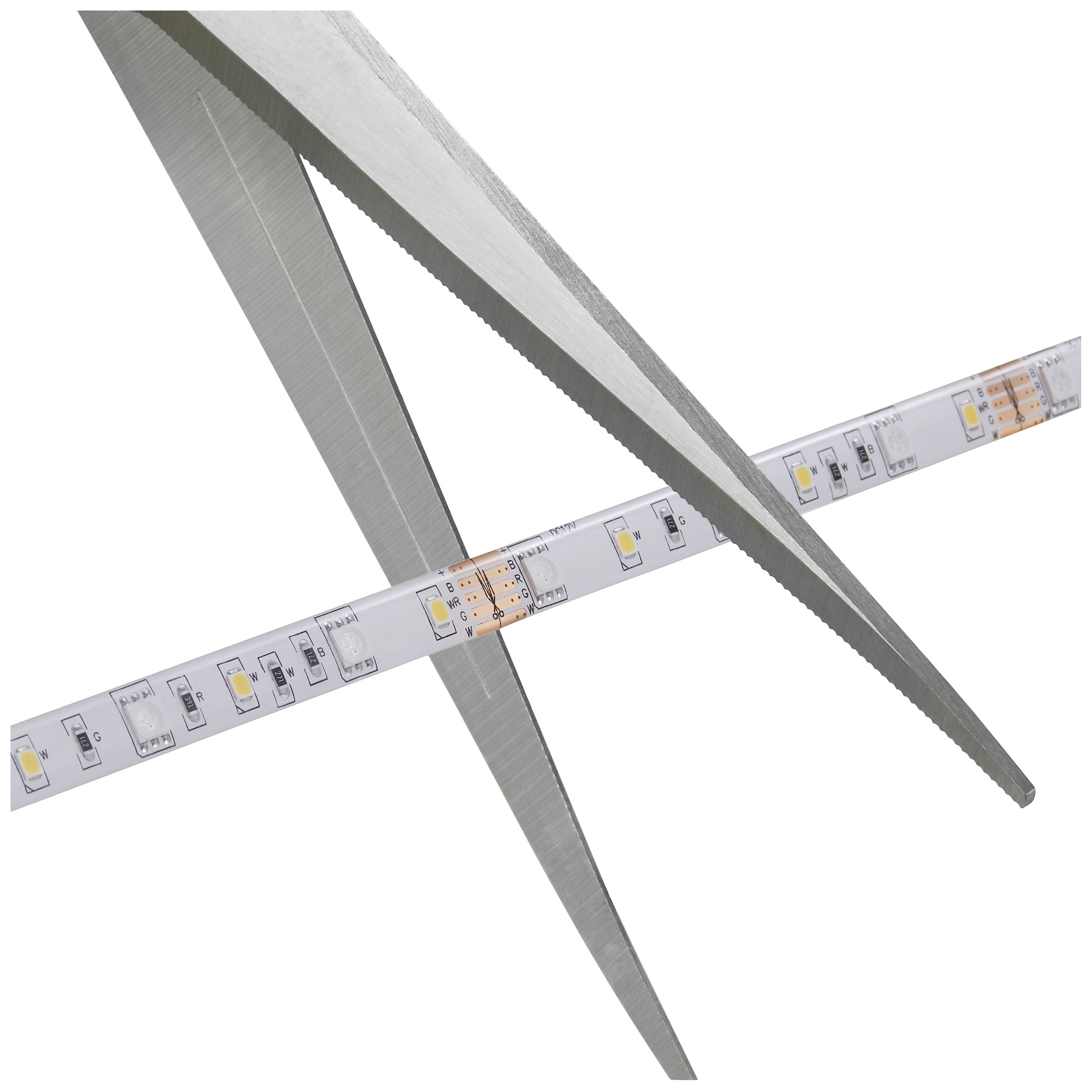 Schere schneidet durch einen LED-Lichtstreifen, symbolisiert die Anpassung oder Kürzung von Beleuchtungselementen.