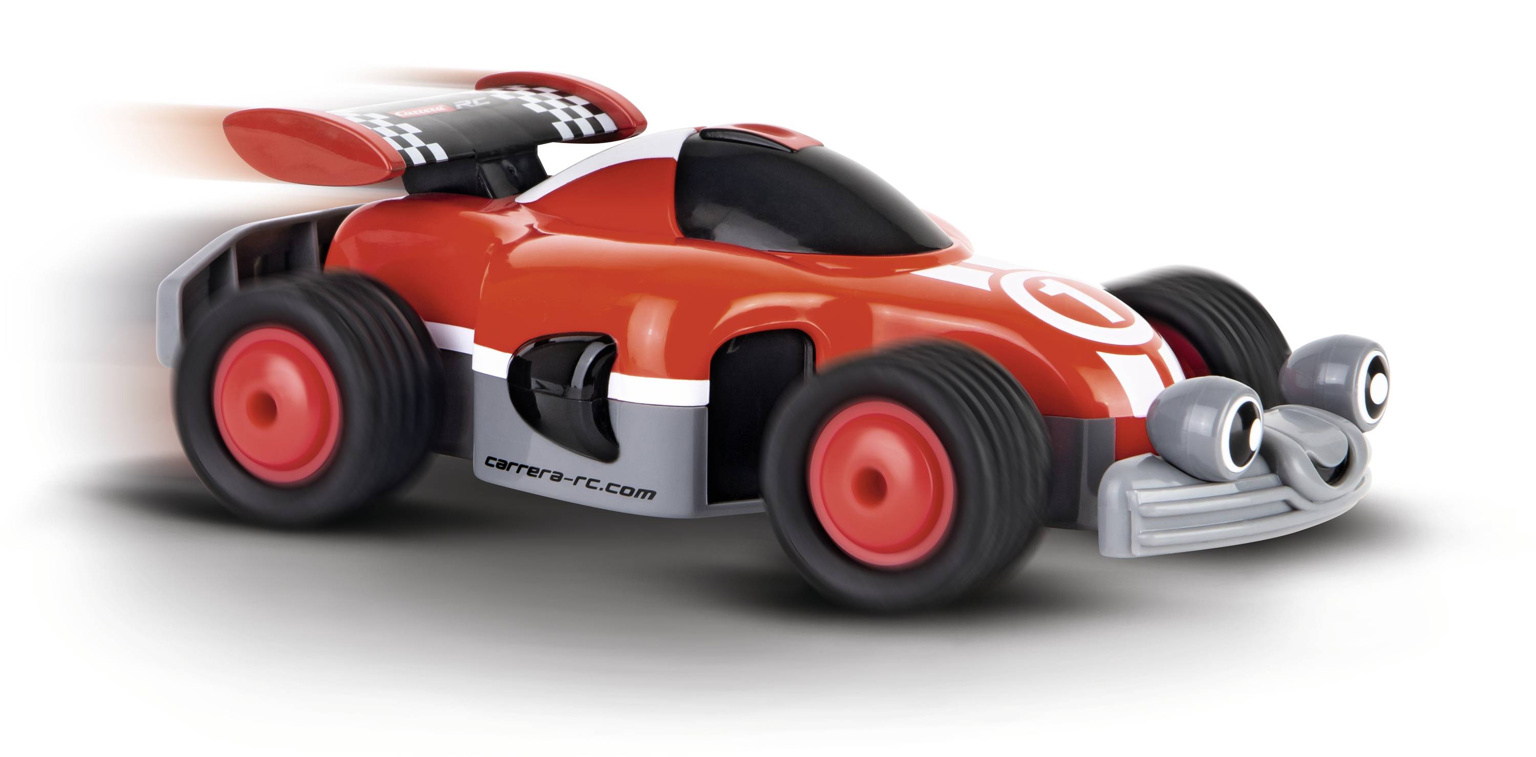 Ein rotes Spielzeugauto mit großen Augen und einem Lächeln auf der Stoßstange fährt schnell nach links.