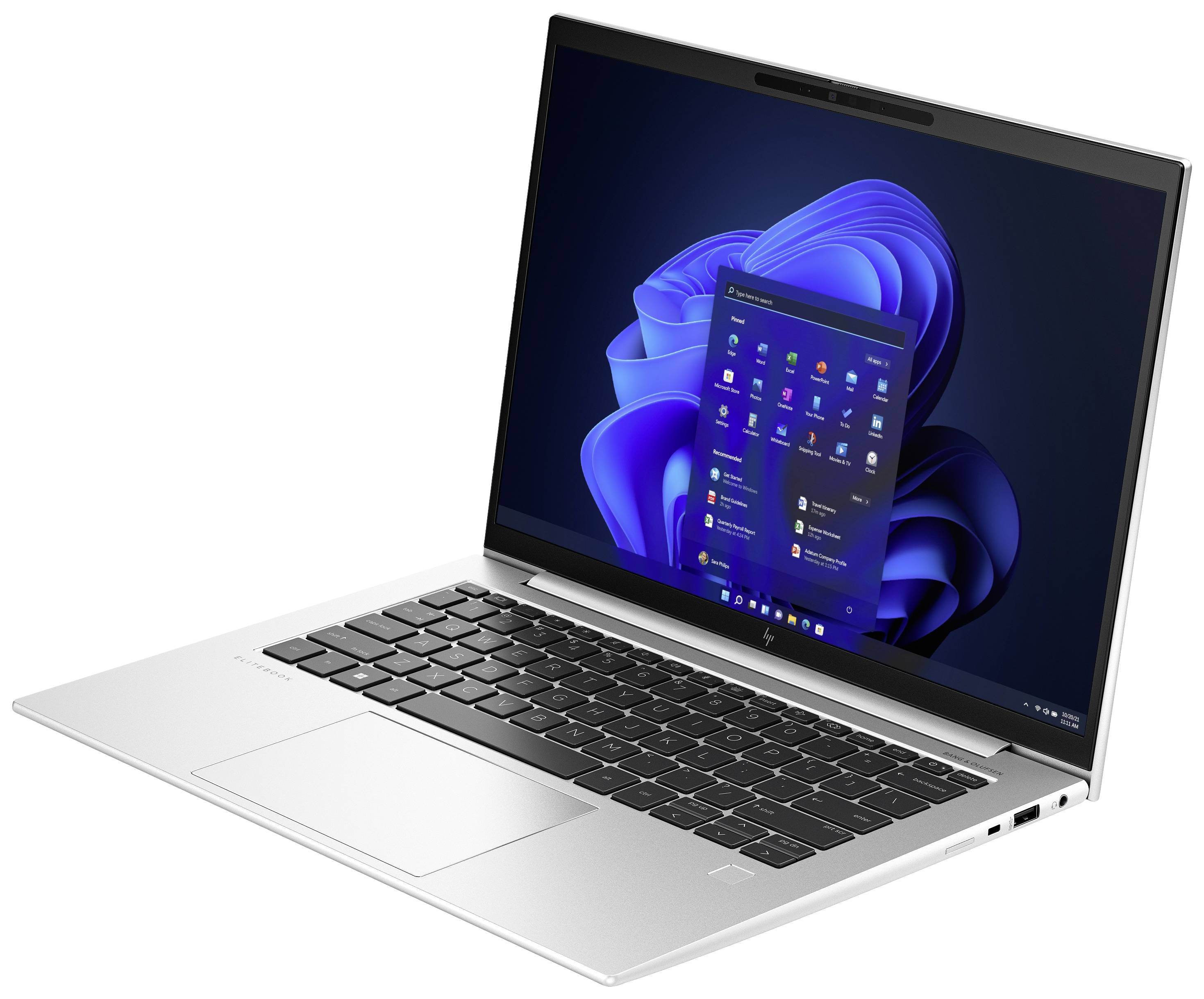 Ein silberner Laptop mit geöffneter Windows-Oberfläche zeigt geöffnete Anwendungen auf dem Bildschirm.